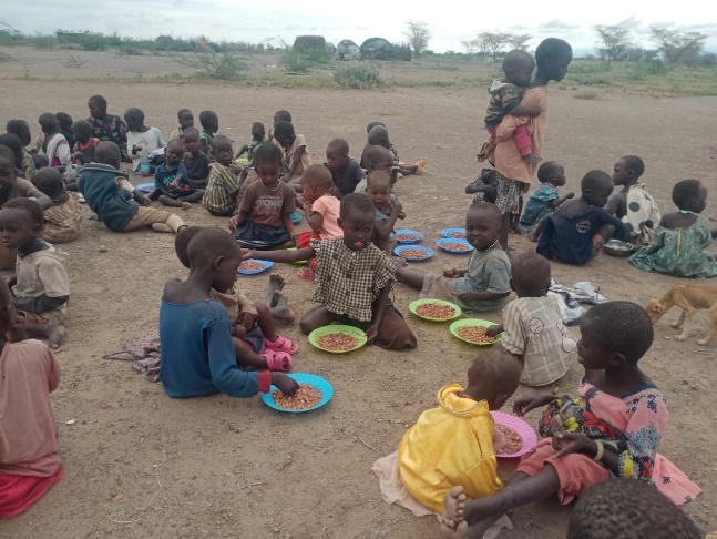 Lunchtime meal being shared with village children